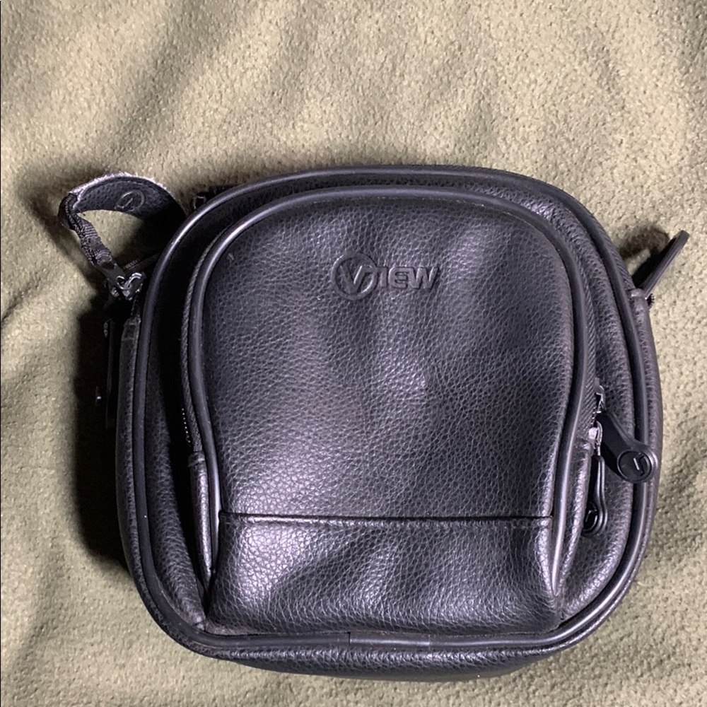 View black CD player and disc bag with zippers and handles. Approx 8” x 8” x 3”